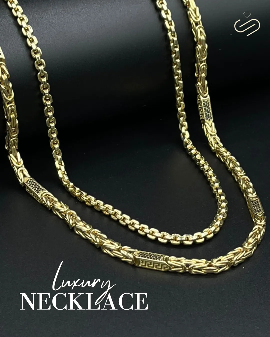 Subashi Jewellery flat lay of two gold byzantine chains on dark slate, captioned Luxury Necklace.